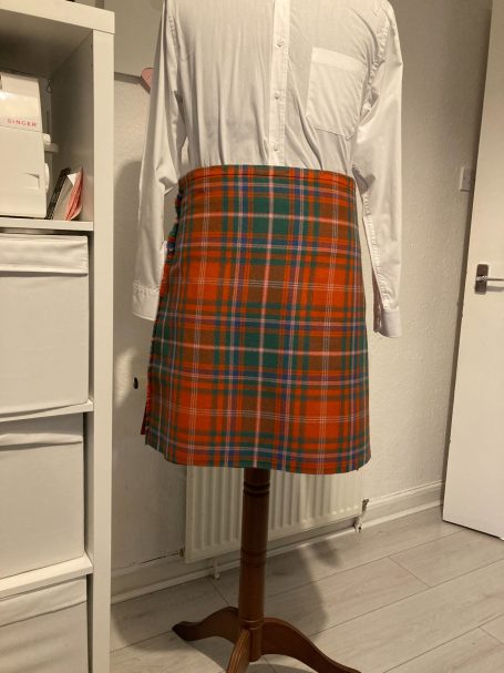 Bespoke kilt alteration involving full reconstruction, reshaping, and adjustment for a perfect fit.