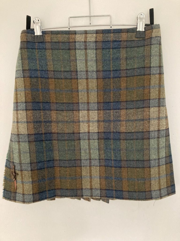 Waist adjustment on tartan kilt showing repositioned buckles - Glasgow kilt alteration service.