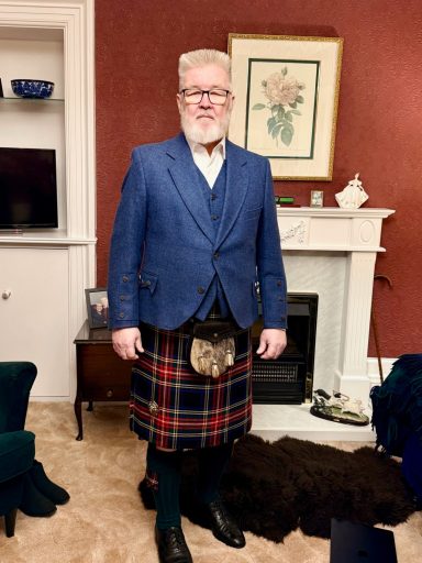 Customer wearing altered kilt, jacket, and waistcoat.